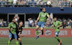 Midfielder Ozzie Alonso (6), newly acquired by Minnesota United, heads the ball during the second half of an MLS soccer match against Sporting Kansas 