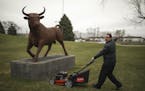 Toro's Senior Marketing Manager J. Wade Tollison demonstrates a walk-behind mower with PoweReverse on the grounds of the Toro Company's corporate offi