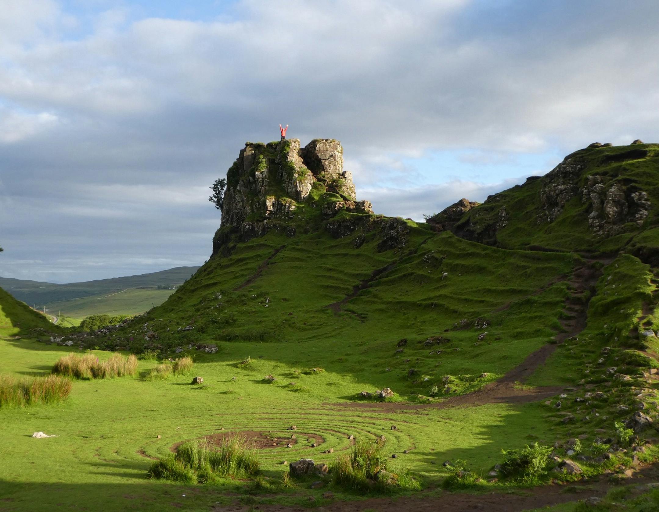 Chris and Bob Finn of Chanhassen
The Scene/Destination: Fairy Glen, Isle of Skye, Scotland. There are very good descriptions online of this unique geological formation and of the Isle of Skye in general. Perhaps you have already seen this picture from previous travelers photo submissions but wanted to submit it anyway.
Why This Photo: While on a recent trip, my wife and I were intent on seeing this very unusual and unique formation while on the Isle of Skye. We arrived at this spot very early in