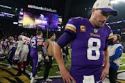 Kirk Cousins walks off the field after the Vikings' playoff loss to the Giants on Jan. 15, 2023, at U.S. Bank Stadium.