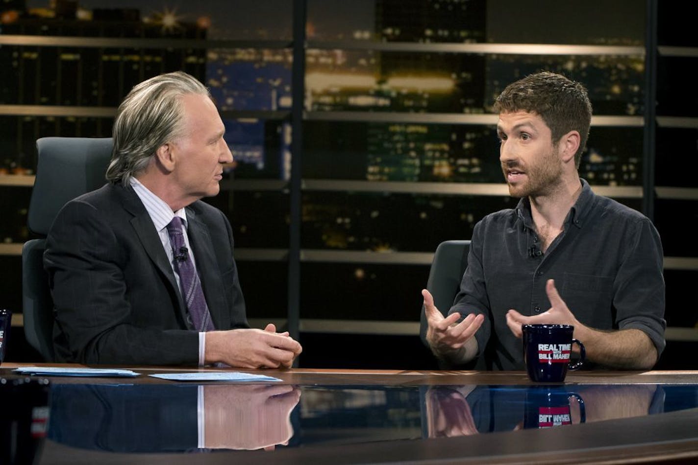 In this photo provided by HBO, Bill Maher, left, speaks with Tristan Harris, a co-founder of Time Well Spent, during a segment of his "Real Time with Bill Maher," Friday, June 2, 2017.