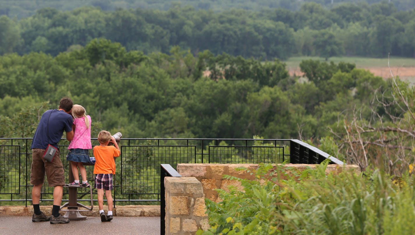 (left to right) Todd Shanafelt and his children, Audrey, (age-7) and Sidney, (age-5 1/2) looked out from the observation deck at the Minnesota Valley Wildlife Refuge, in Bloomington on 7/30/13. The three are from Mankato.] Bruce Bisping/Star Tribune bbisping@startribune.com Todd Shanafelt, Audrey Shanafelt, Sidney Shanafelt/source.