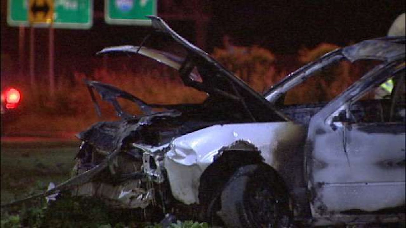 Three men rescued the driver of this car Thursday night after it passed them on fire in the eastbound lanes of Interstate 394 near Minnetonka. Three in the group sprinted to the car, broke open the driver's window, unlocked the door and managed to pull him out.