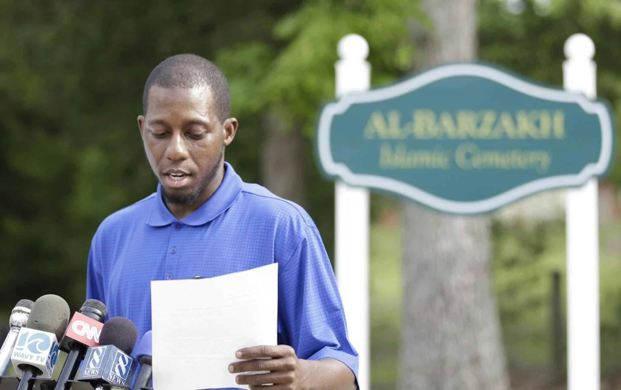 Vice President of the Islamic Funeral Services of Virginia, Bukhari Abdel-Alim, reads a statement at the entrance to the Al-Barzakh Islamic Cemetery where Boston Marathon bombing suspect Tamerlan Tsarnaev is buried in Doswell, Va., Friday, May 10, 2013. �Ruslan Tsarni, the uncle of Tamerlan Tsarnaev said Tsarnaev was buried in the cemetery in Doswell, near Richmond. �Tsarnaev was killed April 19 in a getaway attempt after a gunbattle with police. His younger brother, Dzhokhar, was captured later