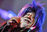 FILE - In this Nov. 12, 2009 file photo, American singer, songwriter and music producer George Clinton performs with the funk, soul and rock music collective Parliament-Funkadelic on stage at the Avo Session in Basel, Switzerland. Clinton and the Black Eyed Peas have settled a lawsuit in which the funk pioneer accused the pop group of improperly sampling his music. (AP Photo/Keystone, Georgios Kefalas, File) ORG XMIT: LA106