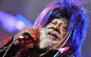 FILE - In this Nov. 12, 2009 file photo, American singer, songwriter and music producer George Clinton performs with the funk, soul and rock music col