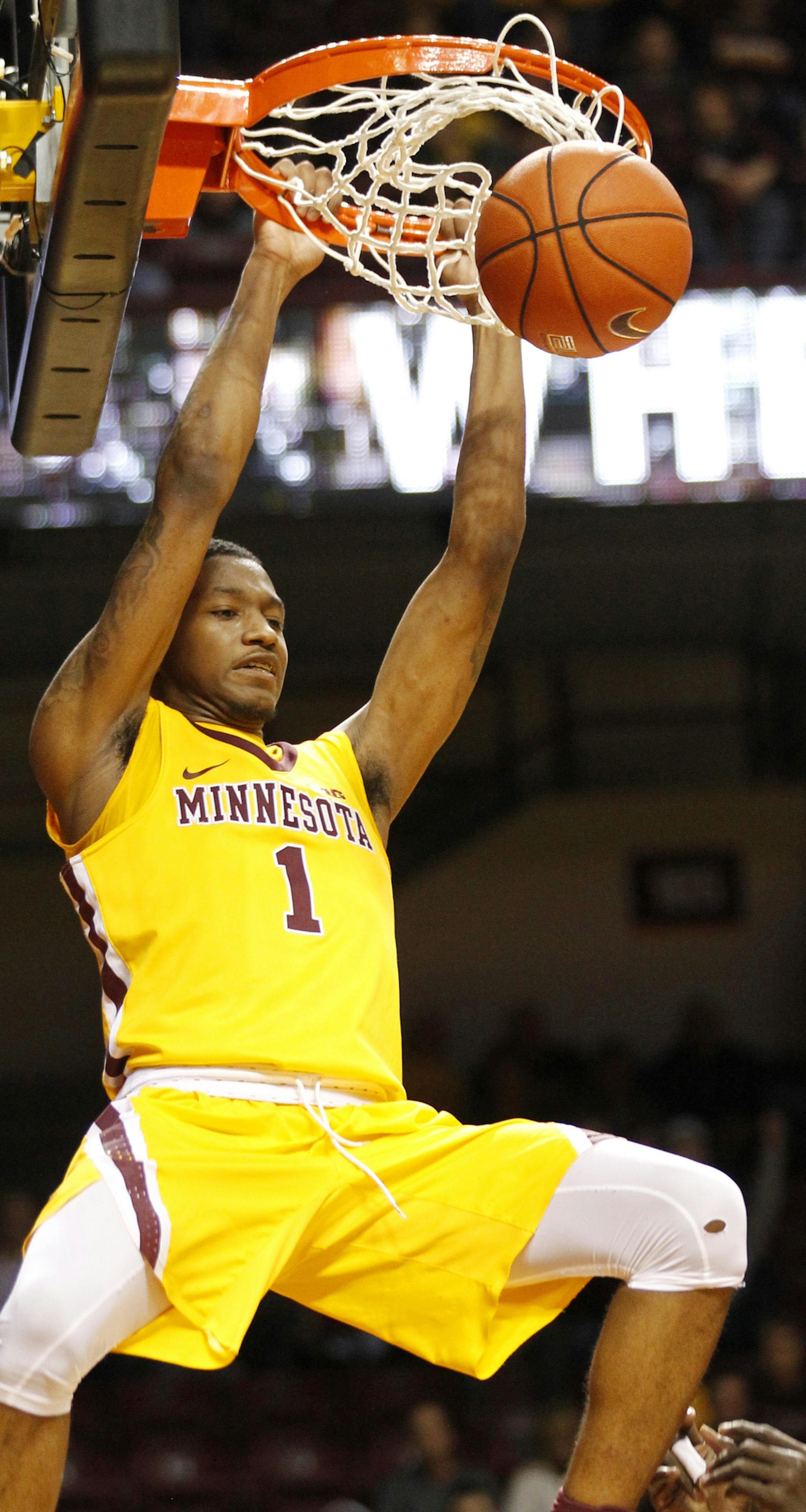 Minnesota guard Dupree McBrayer dunks (1) against Arkansas State in the second half of an NCAA college basketball game Friday, Dec. 23, 2016, in Minneapolis. (AP Photo/Andy Clayton-King)