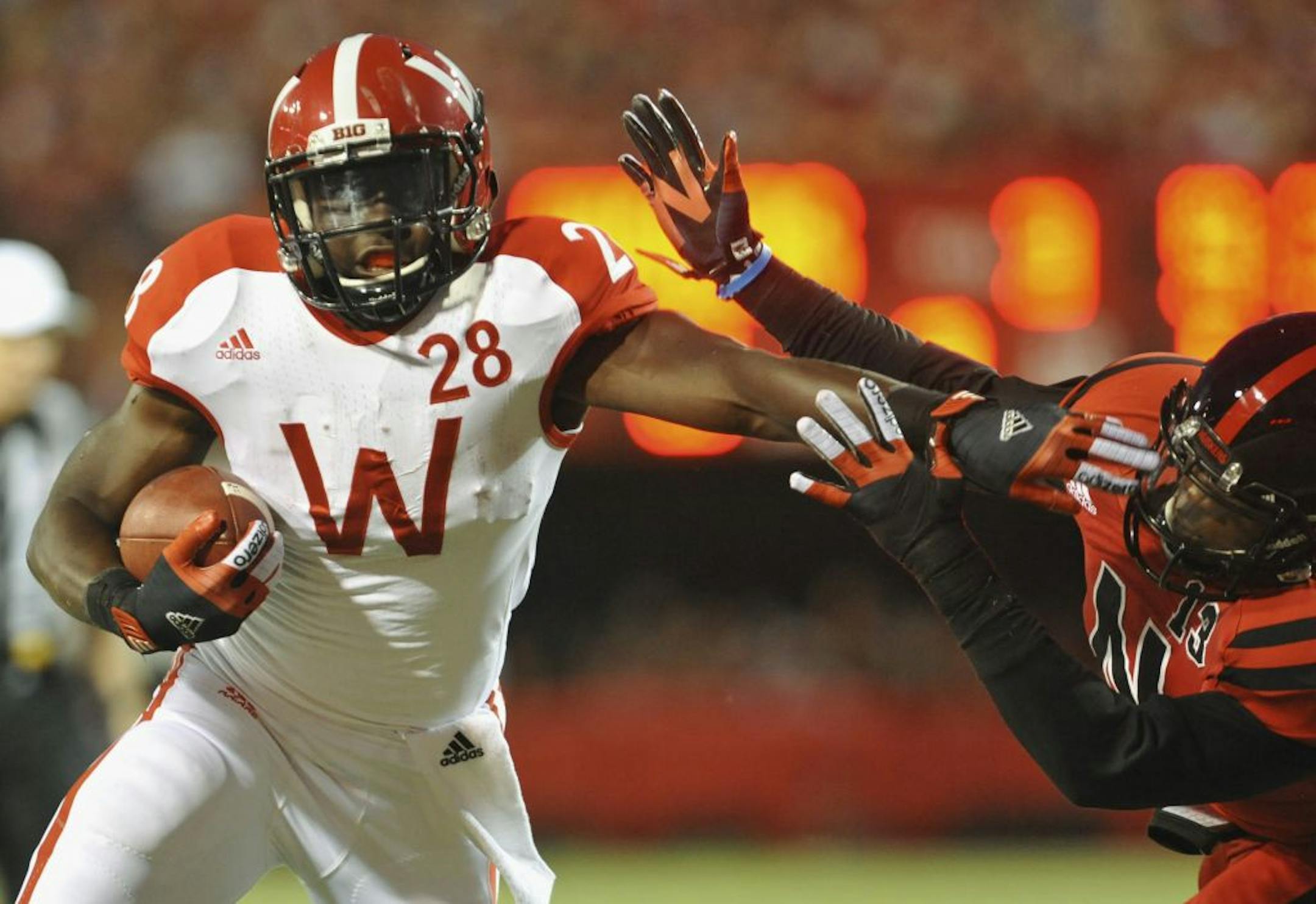 Wisconsin's Montee Ball (28) carries the ball for a touchdown against Nebraska's P.J. Smith, in the first half of an NCAA college football game in Lincoln, Neb., Saturday, Sept. 29, 2012.