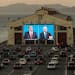 The final presidential debate between then-President Donald Trump and Joe Biden, his Democratic challenger, is projected during a drive-up watch party