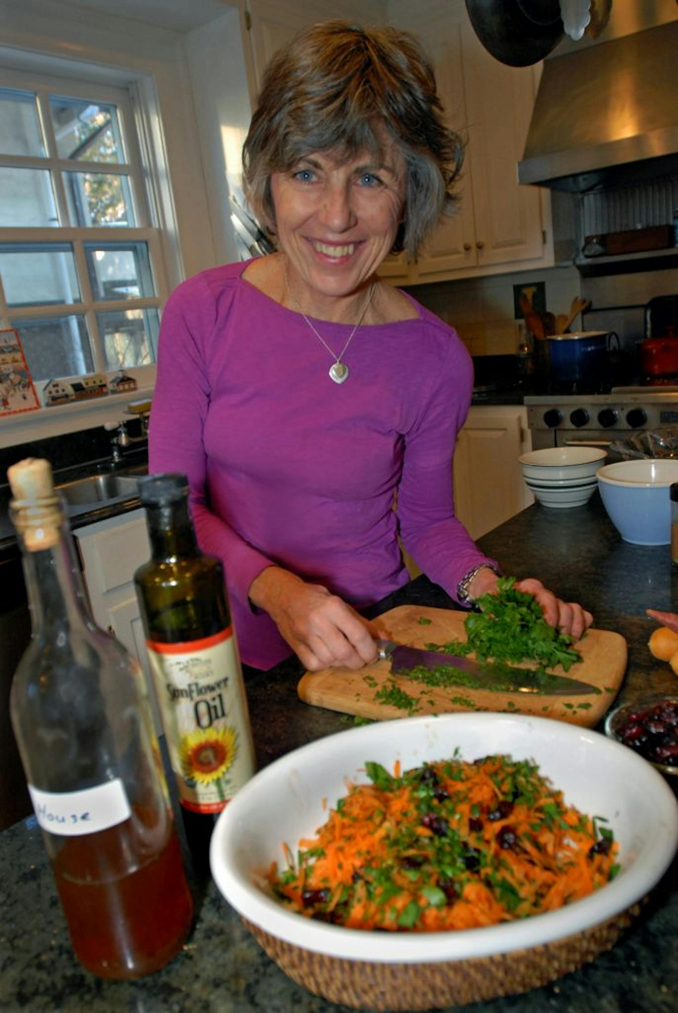 Minneapolis cookbook author Beth Dooley prepared her carrot and parsley salad in her kitchen. Her latest book, "The Northern Heartland Kitchen", is filled with recipes using local and seasonal foods.
