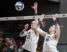 Julia Hanson (22) and Ellie Husemann (16) went for a block in the team’s home opener against Florida on Sept. 4.