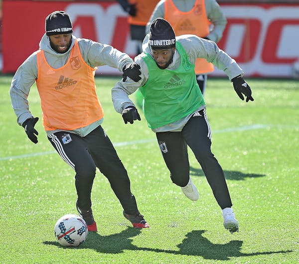 Minnesota United FC's Collen Warner, left, and Kevin Molino, battled for the ball during practice at TCF Bank Stadium, Friday, March 10, 2017 in Minne