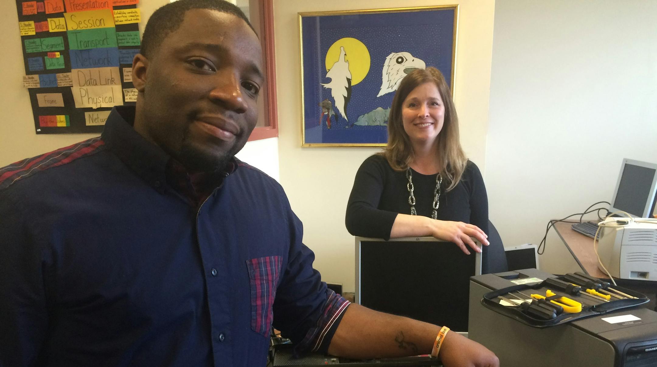 Jacquan Sloan, 28, a graduate of the Takoda Institute tech training program at American Indian Opportunity and Industrialization Center in Minneapolis, doubled his pay last year when left a building security job for Dell Computer in Eden Prairie. Pictured with AIOIC's Mitzi Hobot, who works with employers. Photo: Neal St. Anthony@startribune.com.