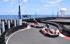Go-karts zip around the two-level Race Track aboard the Norwegian Bliss. The karts can travel up to 30 mph and are available to ride for $7 per passen