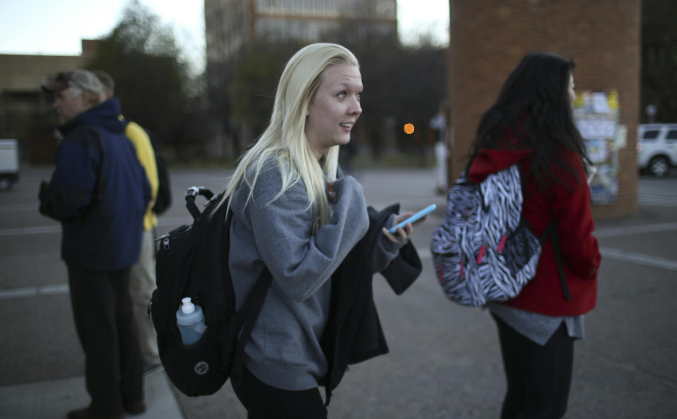 A man who showed a gun attempted to rob a woman in a hallway of Anderson Hall on the U of M's West Bank on Nov. 11, 2013. In this photo, a student came out of Anderson Hall after retrieving her jacket, which she left behind when she first left the building during the incident.