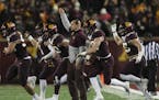 Gophers head coach P.J. Fleck signaled to his team in the first half.