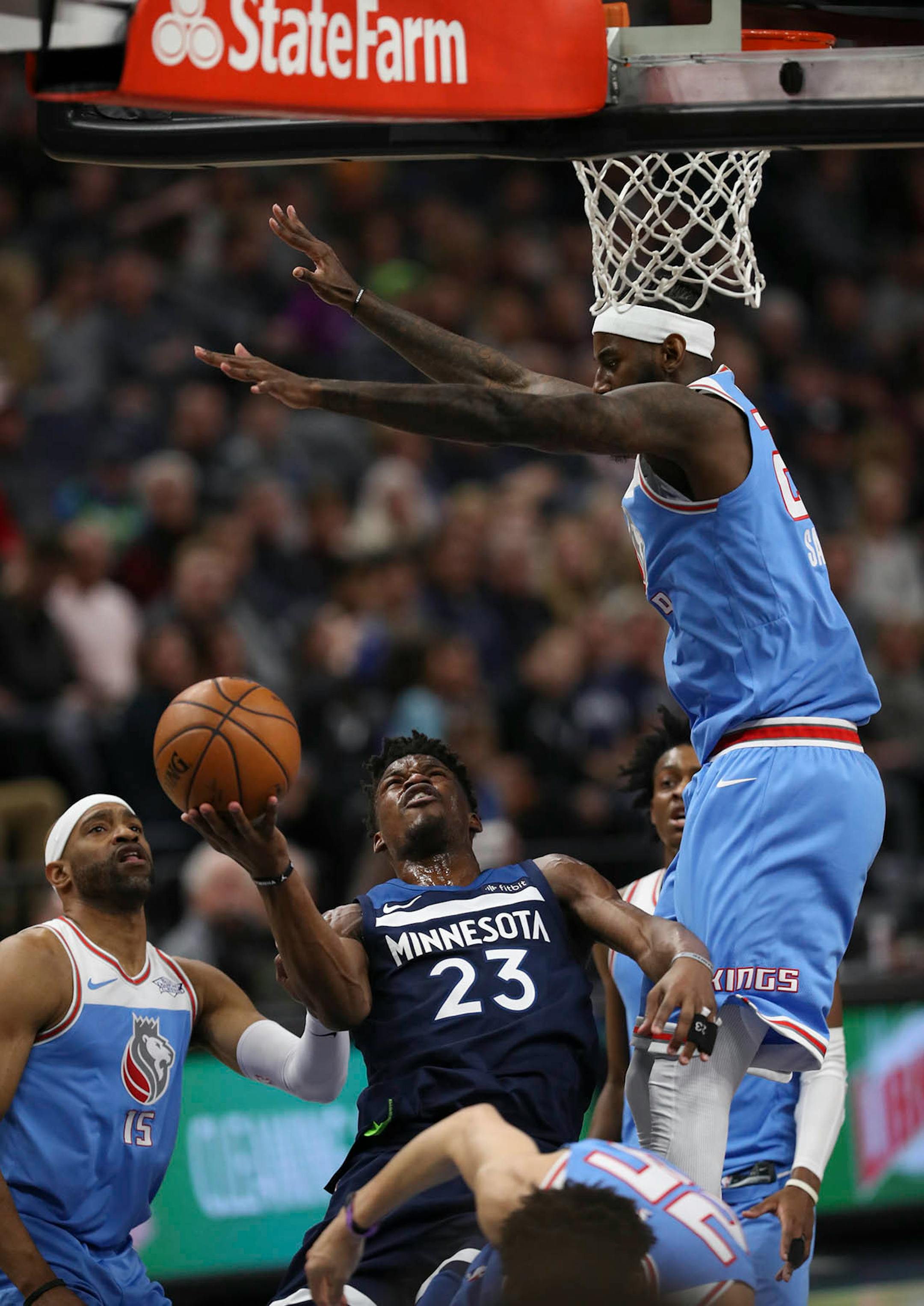 Minnesota Timberwolves guard Jimmy Butler (23) drove through the middle of three Kings defenders to take a fourth quarter shot. He finished the game with18 points.