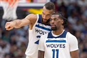 Rudy Gobert and Naz Reid (11) of the Timberwolves talked during the third quarter of their 106-99 victory over the Nuggets in Game 1 on Saturday night
