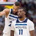 Rudy Gobert and Naz Reid (11) of the Timberwolves talked during the third quarter of their 106-99 victory over the Nuggets in Game 1 on Saturday night