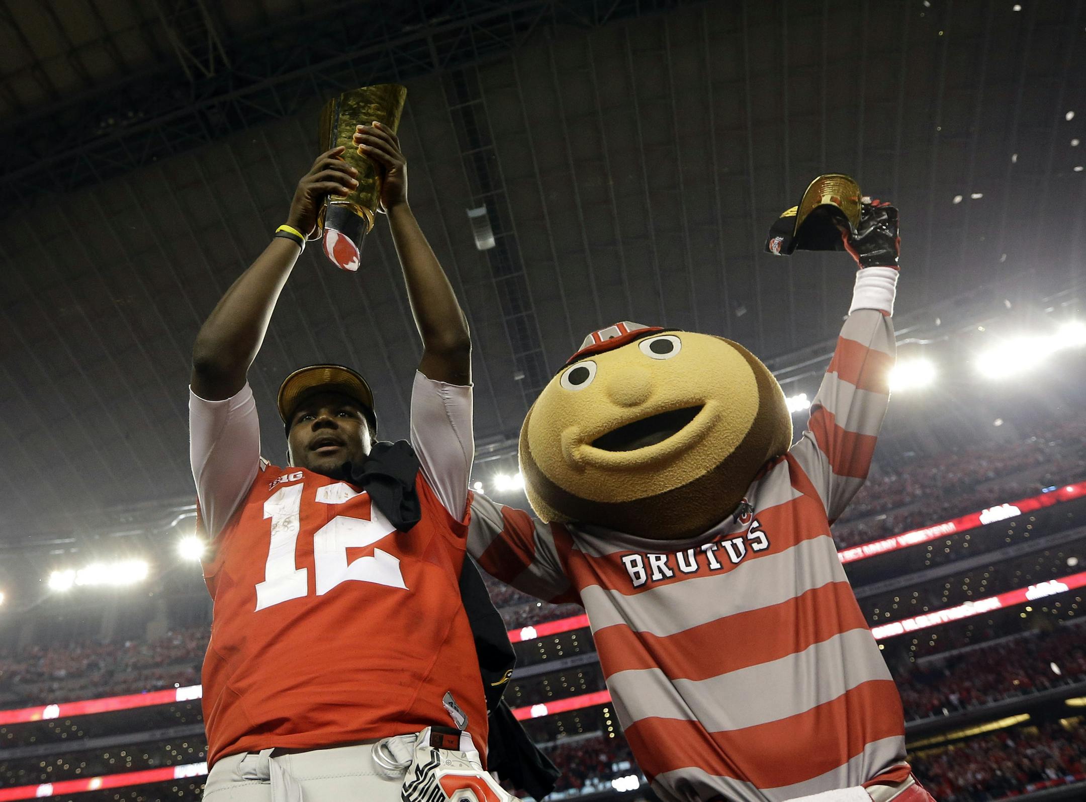 Ohio State quarterback Cardale Jones joined Brutus Buckeye in celebrating the 2014 national championship.