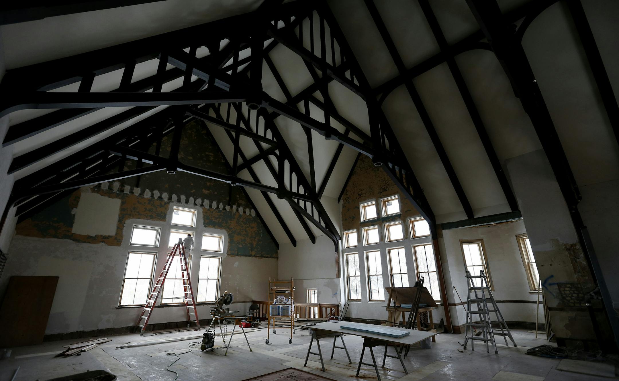 Jim Schaumburg primed windows at the old North Branch Library in north Minneapolis, which is nearing completion as a new job skills training center.