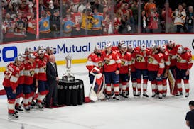 The Florida Panthers pose with the Prince of Wales Trophy after defeating the New York Rangers in Game 6 to win the Eastern Conference finals.