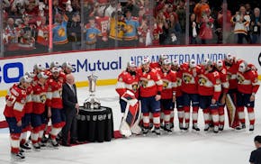 The Florida Panthers pose with the Prince of Wales Trophy after defeating the New York Rangers in Game 6 to win the Eastern Conference finals.