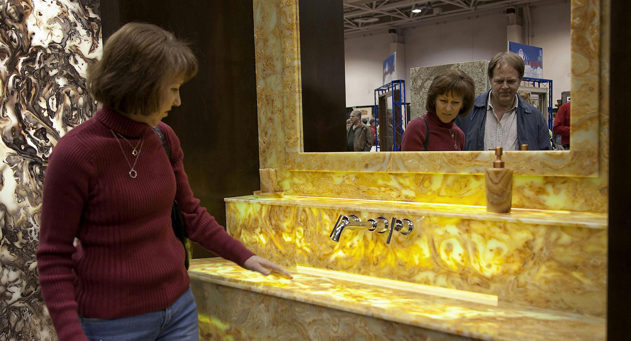 A customer carries plywood through a Home Depot Inc. store in Washington, D.C., U.S., on Monday, Nov. 12, 2012. Home Depot Inc. is scheduled to release earnings data on Nov. 13. Photographer: Andrew Harrer/Bloomberg *** Local Caption *** Mildred Gooden; Meti Robi