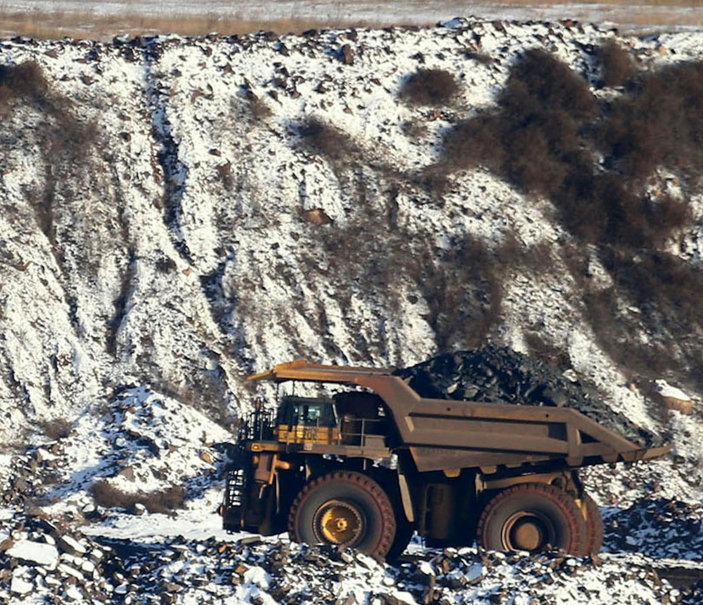 A view of Hull Rust Mine: the world's largest open pit mine, where a giant truck is seen carrying iron ore rocks Tuesday, Nov. 24, 2015, in Hibbing, MN.](DAVID JOLES/STARTRIBUNE)djoles@startribune.com Idled on the Iron Range, workers and entire communities are struggling at a time when the rest of Minnesota is enjoying peace and plenty. The Range has always been a land of booms and busts, but the latest downturn has stretched on so long the governor is calling for a special session to extend une