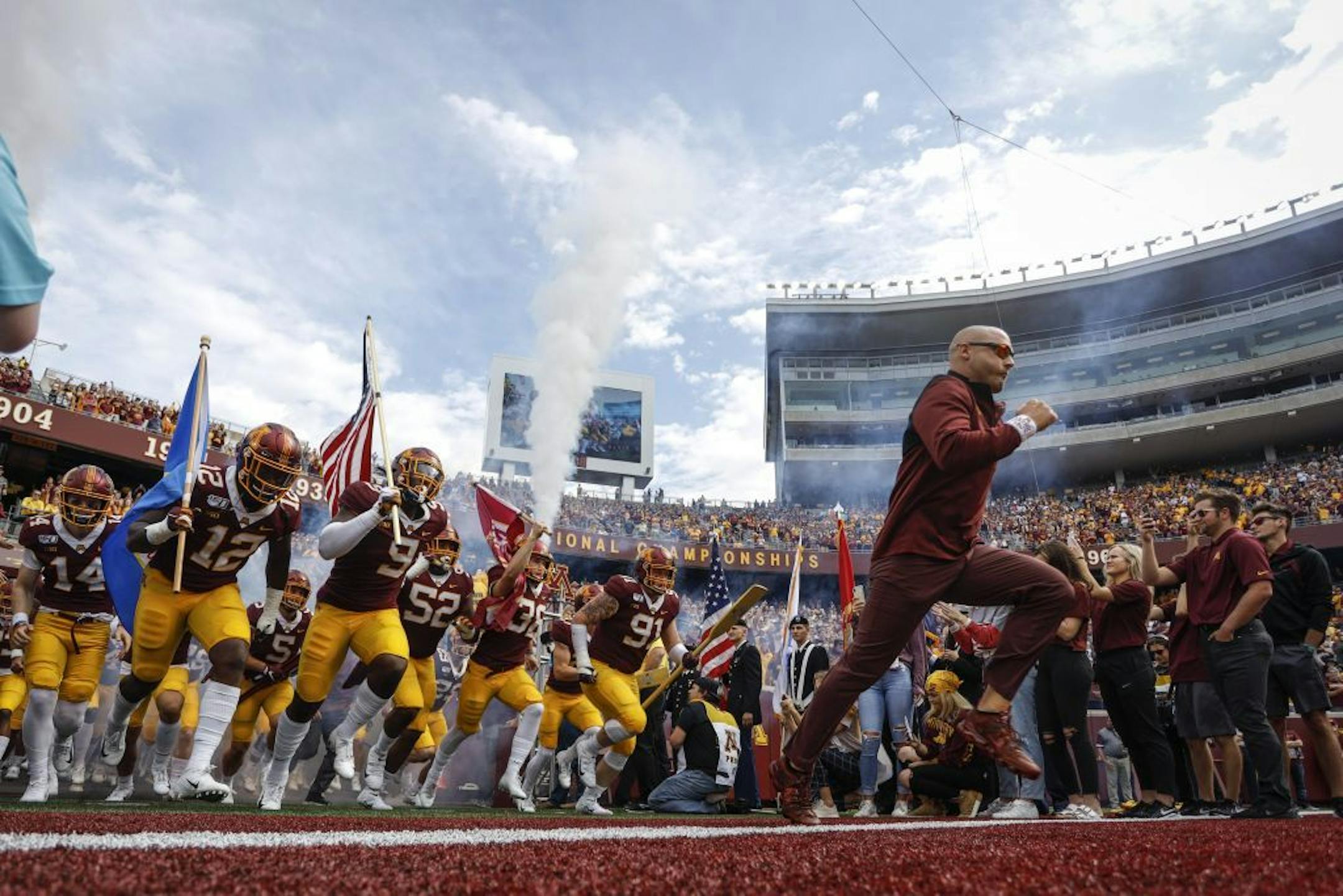 Minnesota head coach P.J. Fleck races onto the field with his team before a game against Georgia Southern in September. The schedule gets increasingly more difficult to close out the season.