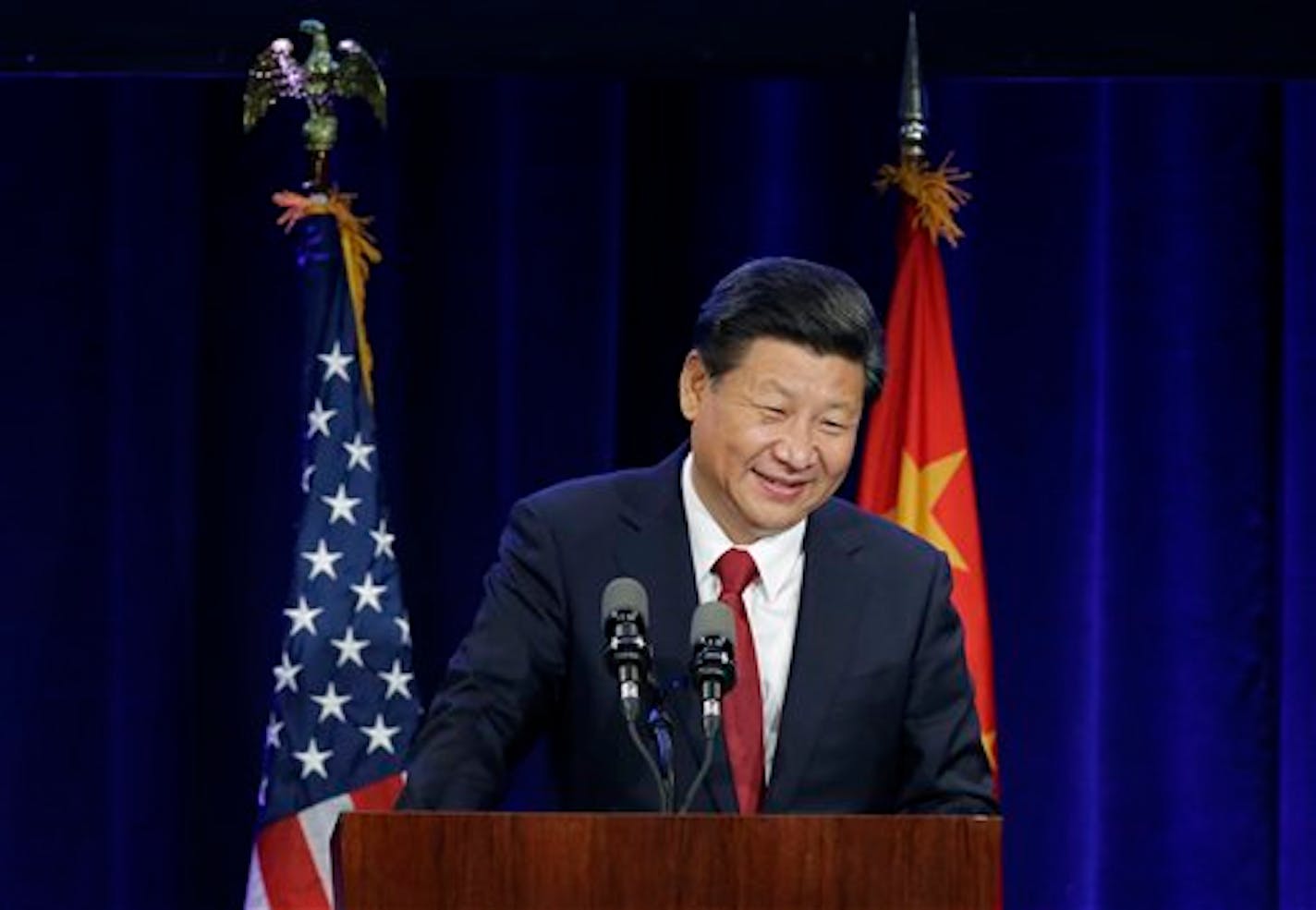 Chinese President Xi Jinping speaks Tuesday, Sept. 22, 2015, at a banquet in Seattle. Xi was in Seattle on his way to Washington, D.C., for a White House state dinner on Friday. (AP Photo/Ted S. Warren)