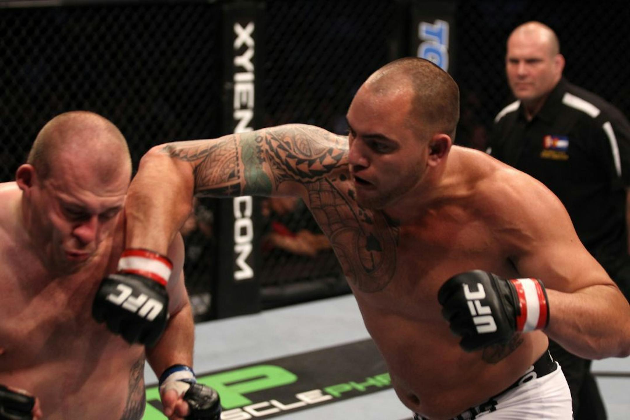 Travis Browne punches Rob Broughton during the UFC 135 event.