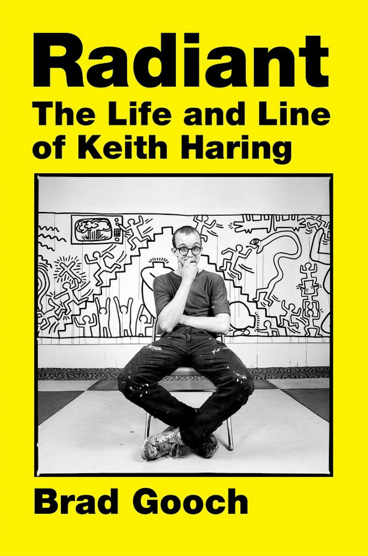 yellow cover of Keith Haring bio "Radiant," with a black and white photo of the artist