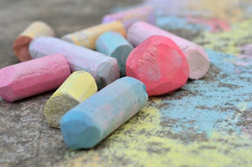 Colored chalk on sidewalk.