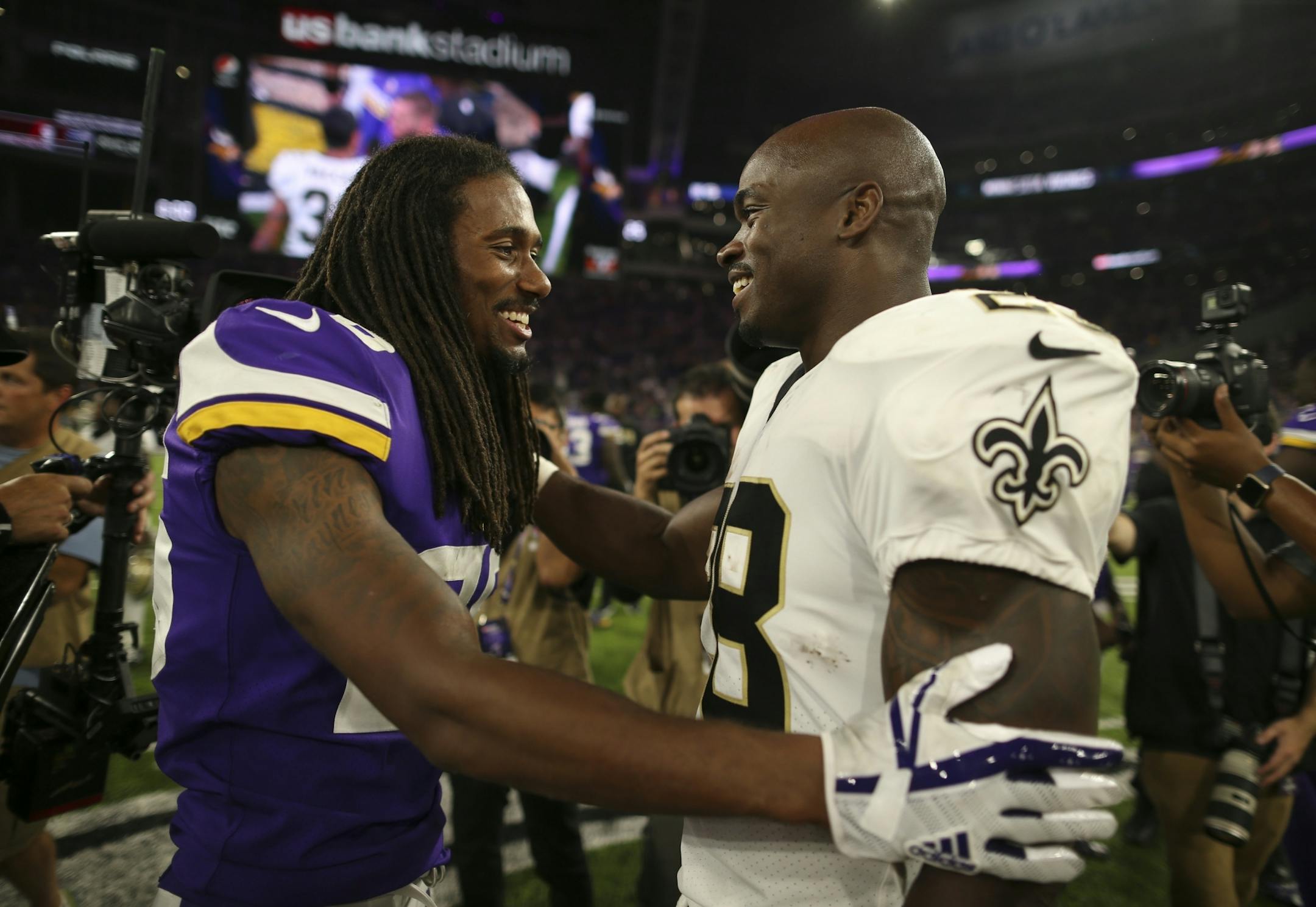 Minnesota Vikings cornerback Trae Waynes (26) greeted his former teammate Adrian Peterson on the field after the game.