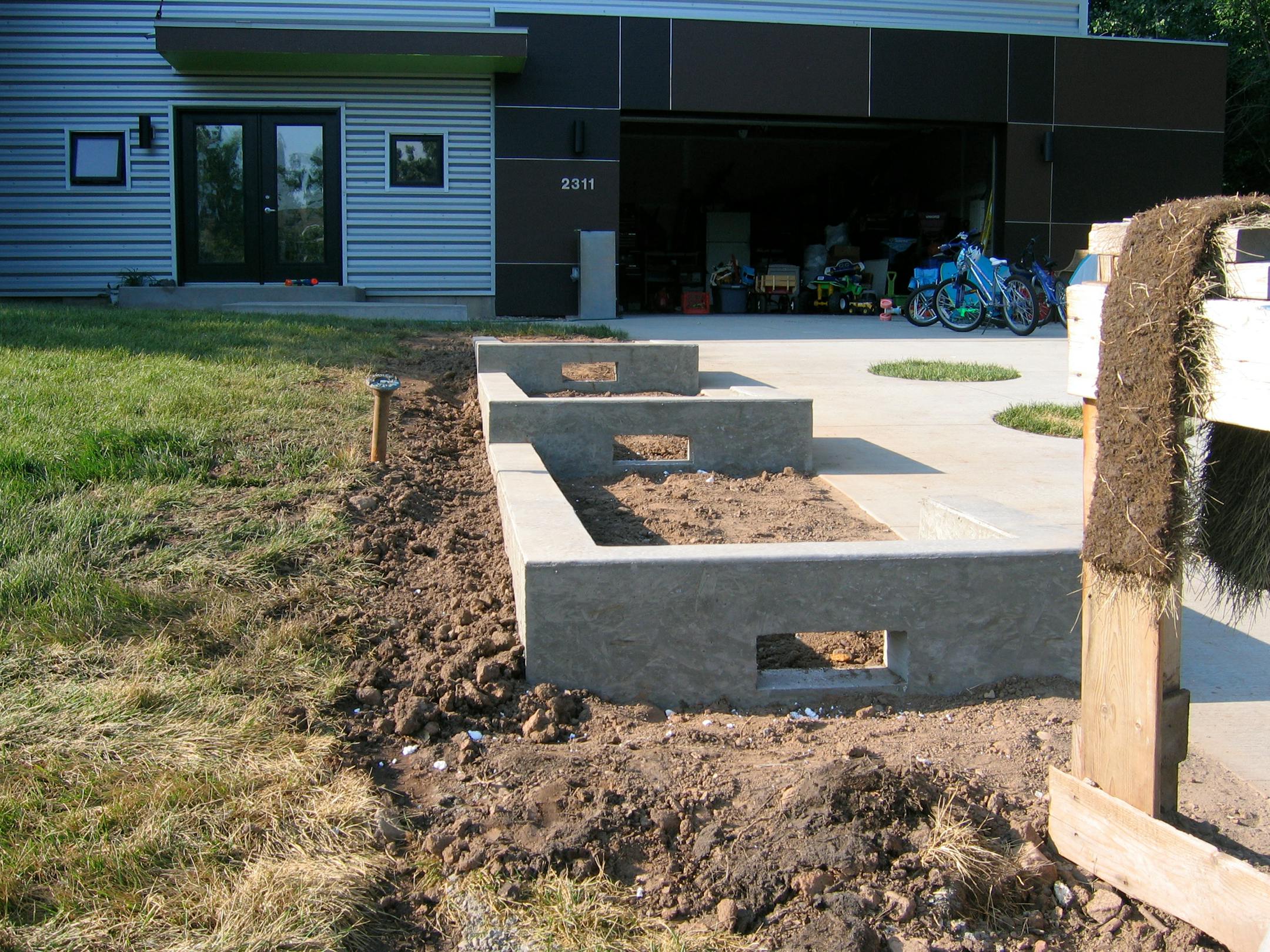 Concrete-framed flower beds.