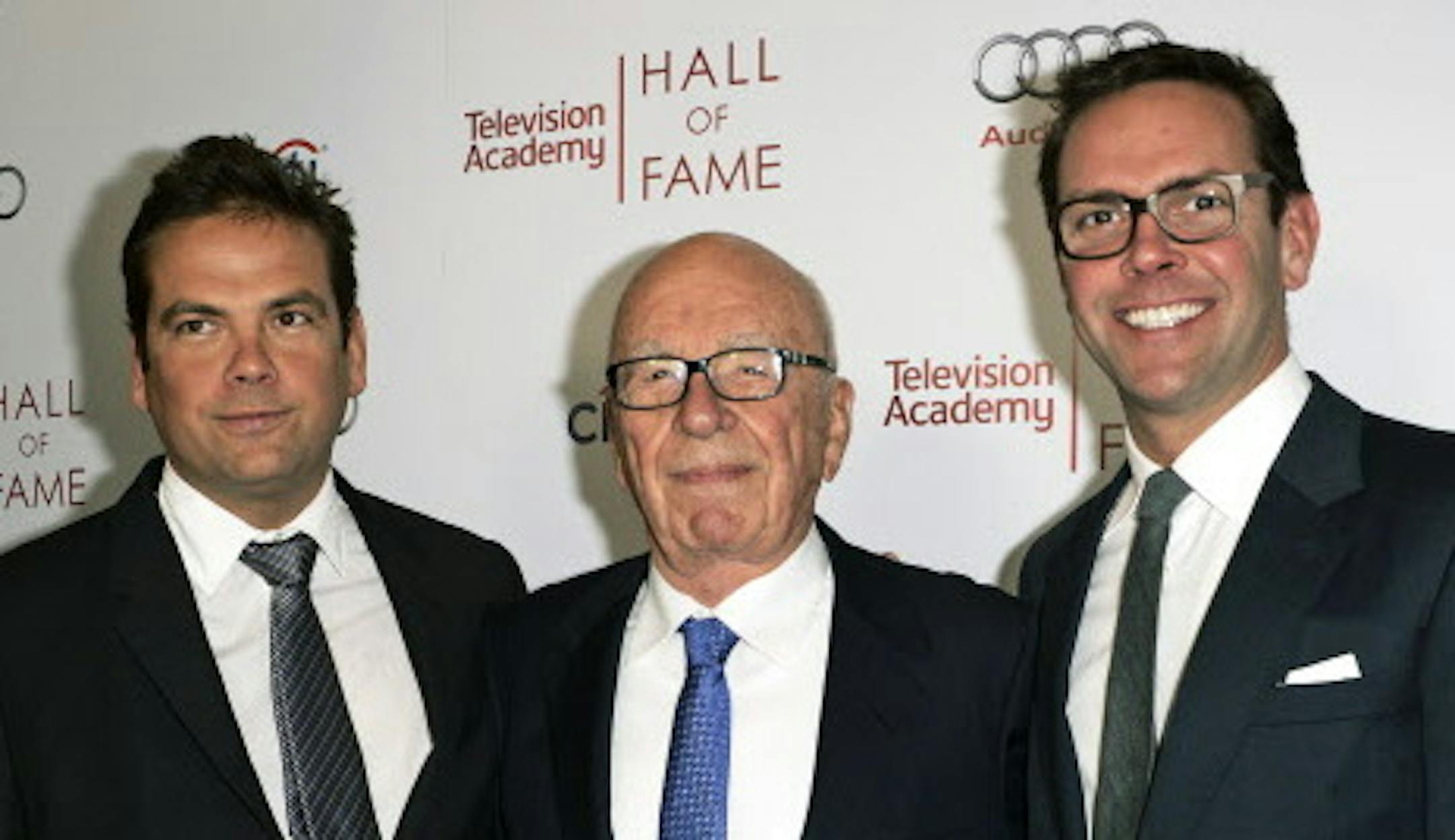 FILE - In this March 11, 2014 file photo, News Corp. Exeuctive Chairman Rupert Murdoch, center, and his sons, Lachlan, left, and James Murdoch attend the 2014 Television Academy Hall of Fame in Beverly Hills, Calif. Twenty-First Century Fox said Tuesday, June 16, 2015, that Rupert Murdoch will turn over more power to his sons on July 1. James Murdoch, 42, will become CEO and Lachlan Murdoch, 43, will become executive co-chairman of the company that day. News of the Murdoch brothers' promotions a
