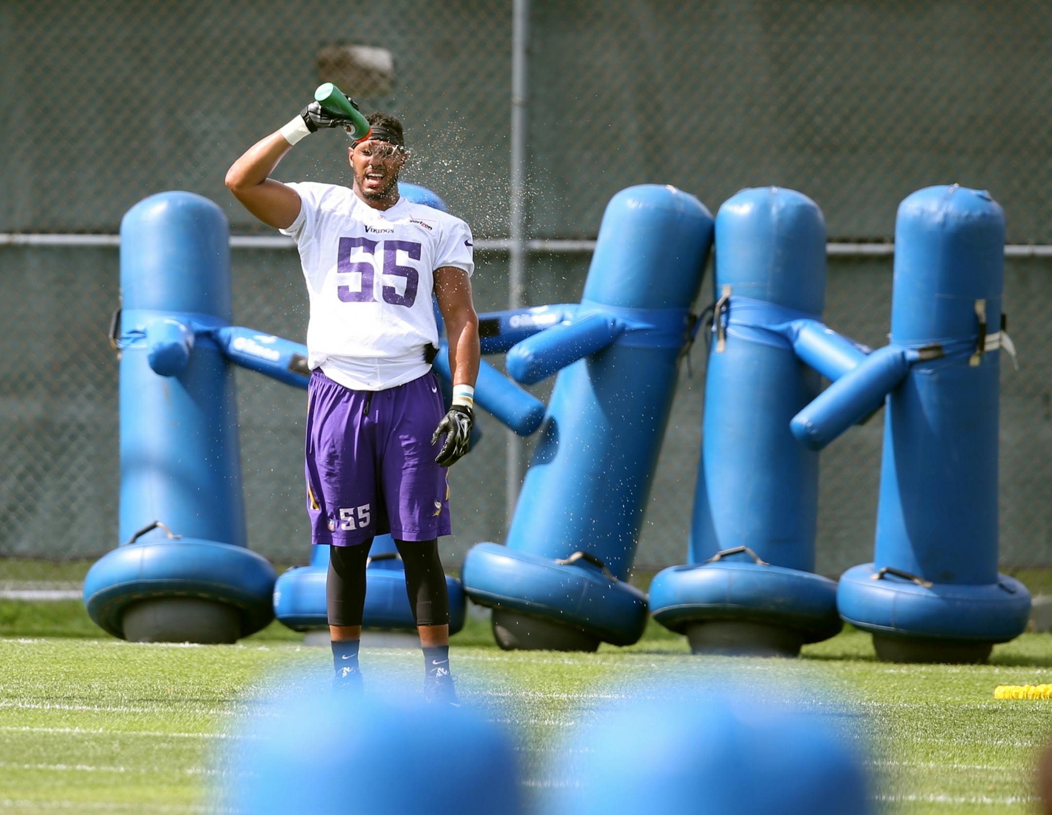 Anthony Barr cooled off with a drink of water during Vikings training camp at Minnesota State University Monday July 27, 2015.