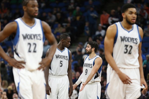 Minnesota Timberwolves teammates center Gorgui Dieng (5) and guard Ricky Rubio (9) talk after a foul was called in Monday's game vs. Portland.