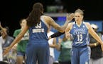 Minnesota Lynx guard Lindsay Whalen (13) is congratulated by Minnesota Lynx guard Seimone Augustus (33) after being fouled during a game in July.