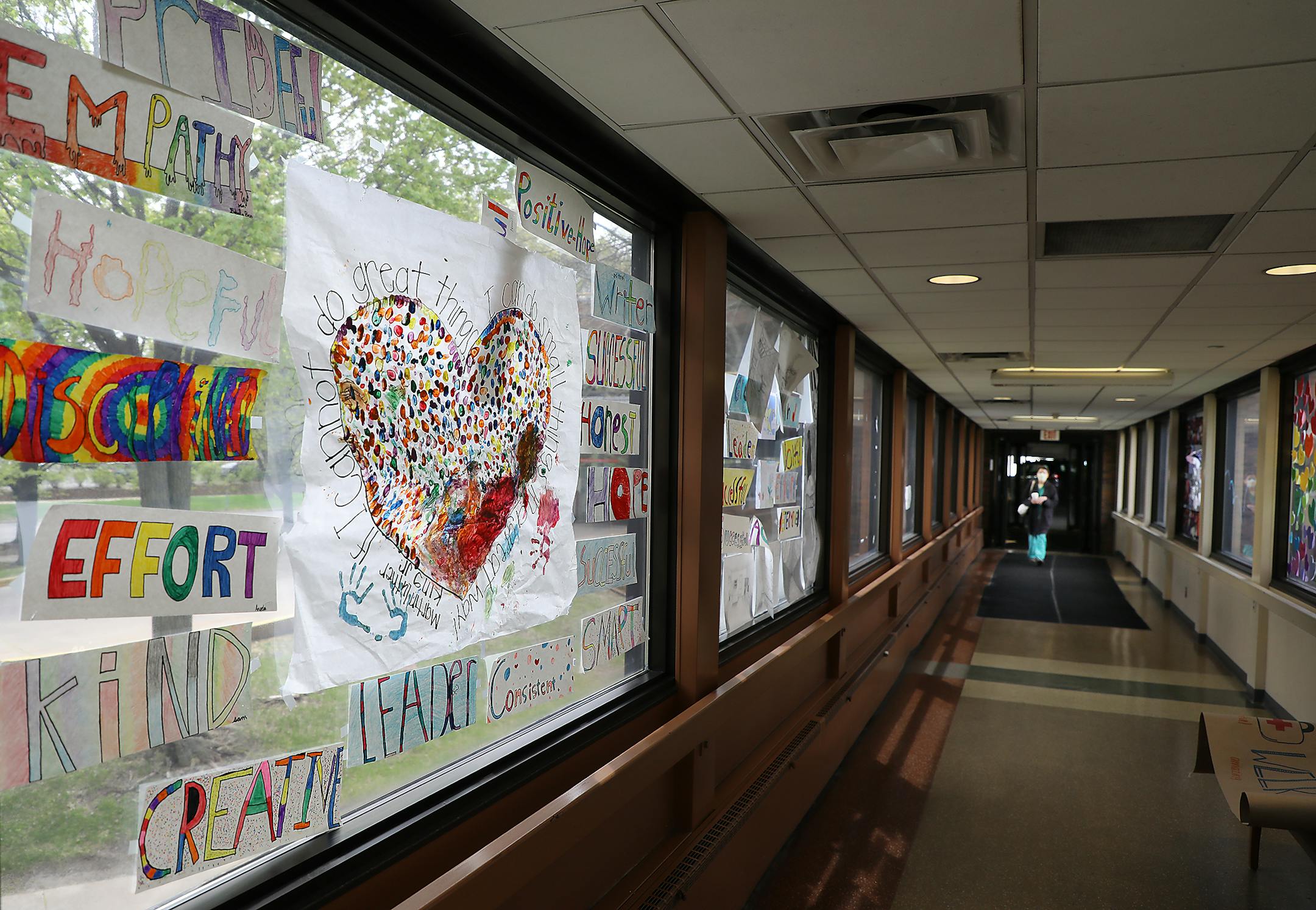 The skyway from the parking ramp leading to Bethesda Hospital is filled with artwork and words of encouragement for healthcare workers.