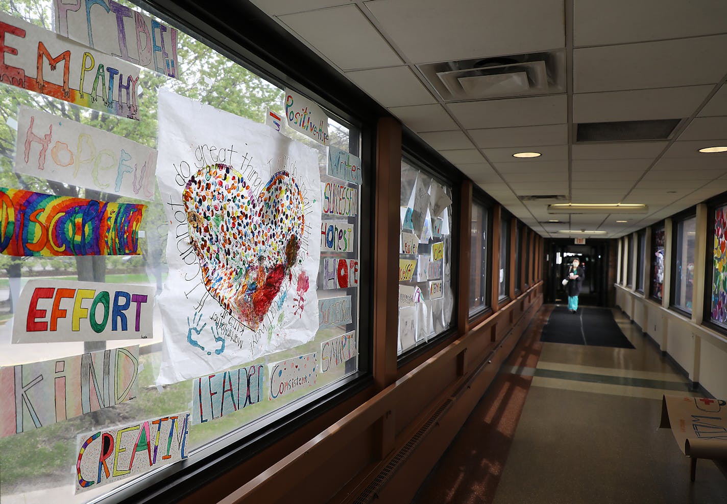 The skyway from the parking ramp leading to Bethesda Hospital is filled with artwork and words of encouragement for healthcare workers.