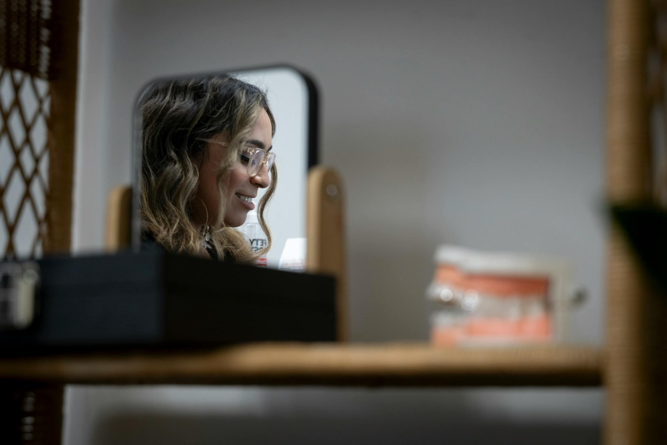 Mirna Lovo, owner of Pearly Whites MN, talks to clients in her office in Burnsville, Minn. on Thursday, June 29, 2023.