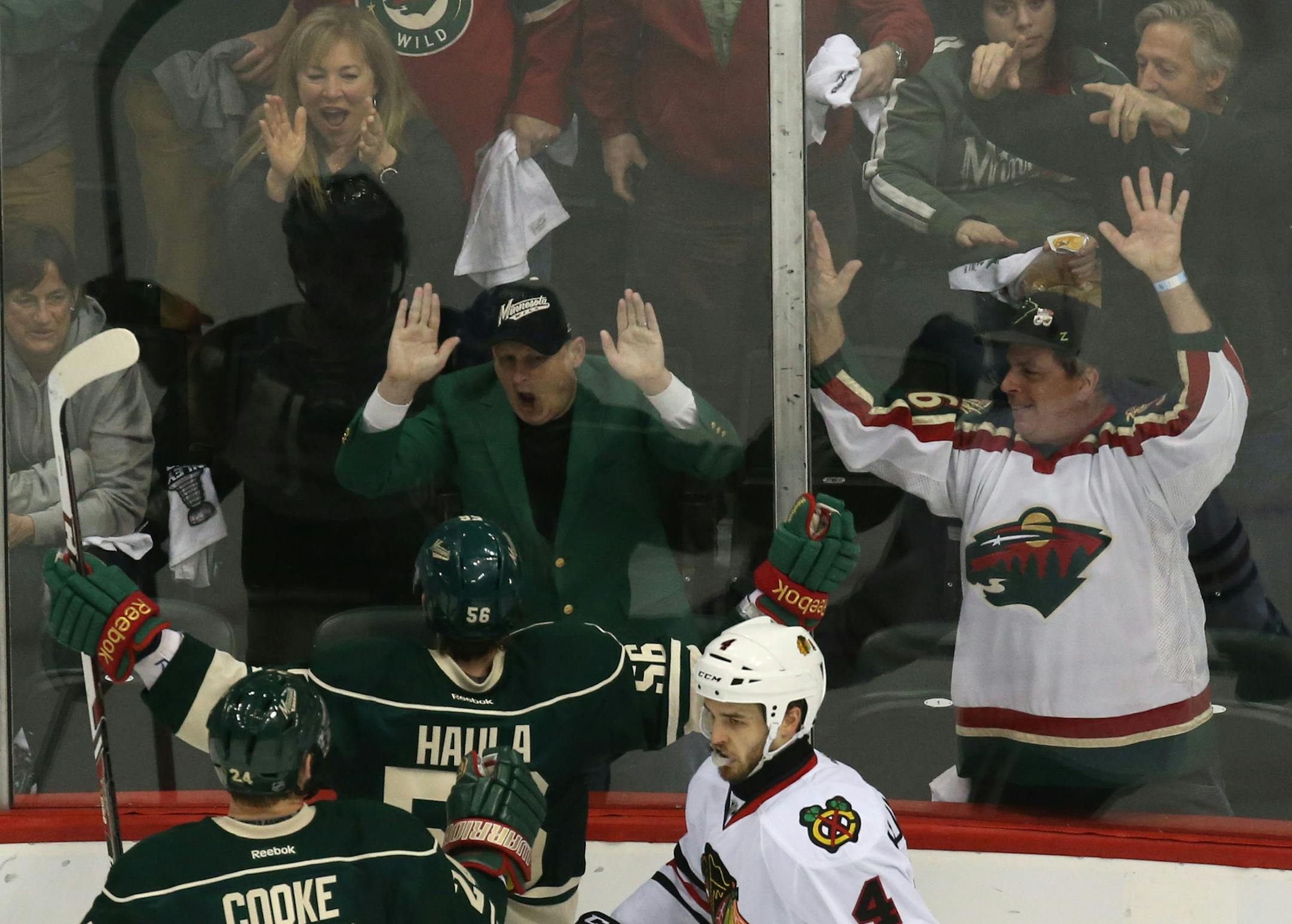 Minnesota Wild left wing Erik Haula (56) celebrate with fansafter scoring on Chicago Blackhawks goalie Corey Crawford (50) to tie the game during the second period of their game Tuesday night at Xcel Energy Center in St. Paul. ] JEFF WHEELER ‚Ä¢ jeff.wheeler@startribune.com The Minnesota Wild faced the Chicago Blackhawks in game 6 of their playoff series Monday night, May 13, 2014 at Xcel Energy Center in St. Paul.