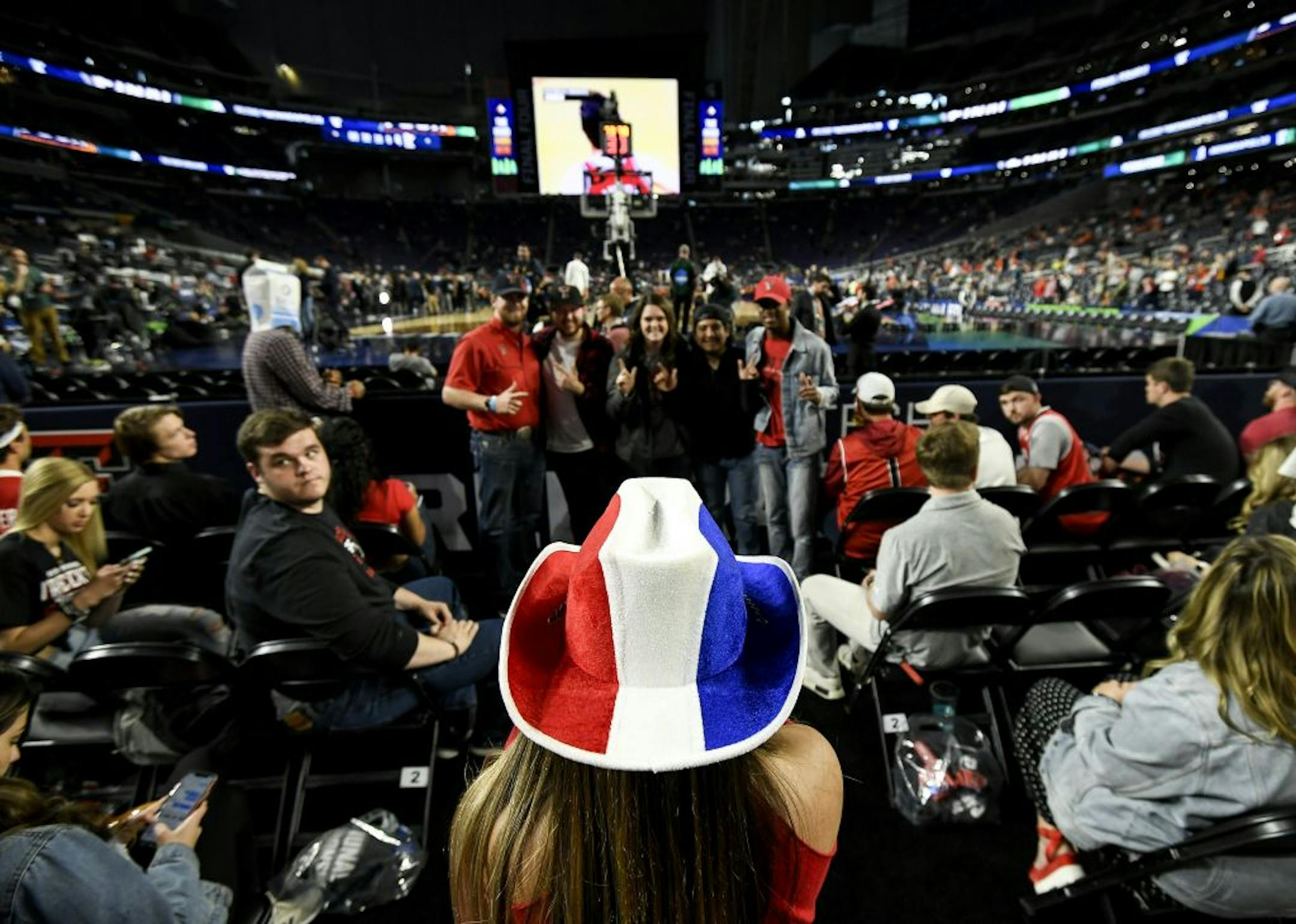 Natalie Elizondo, a Texas Tech freshman studying pre-med, took photos of fellow students in their student section before Monday night's national championship game.