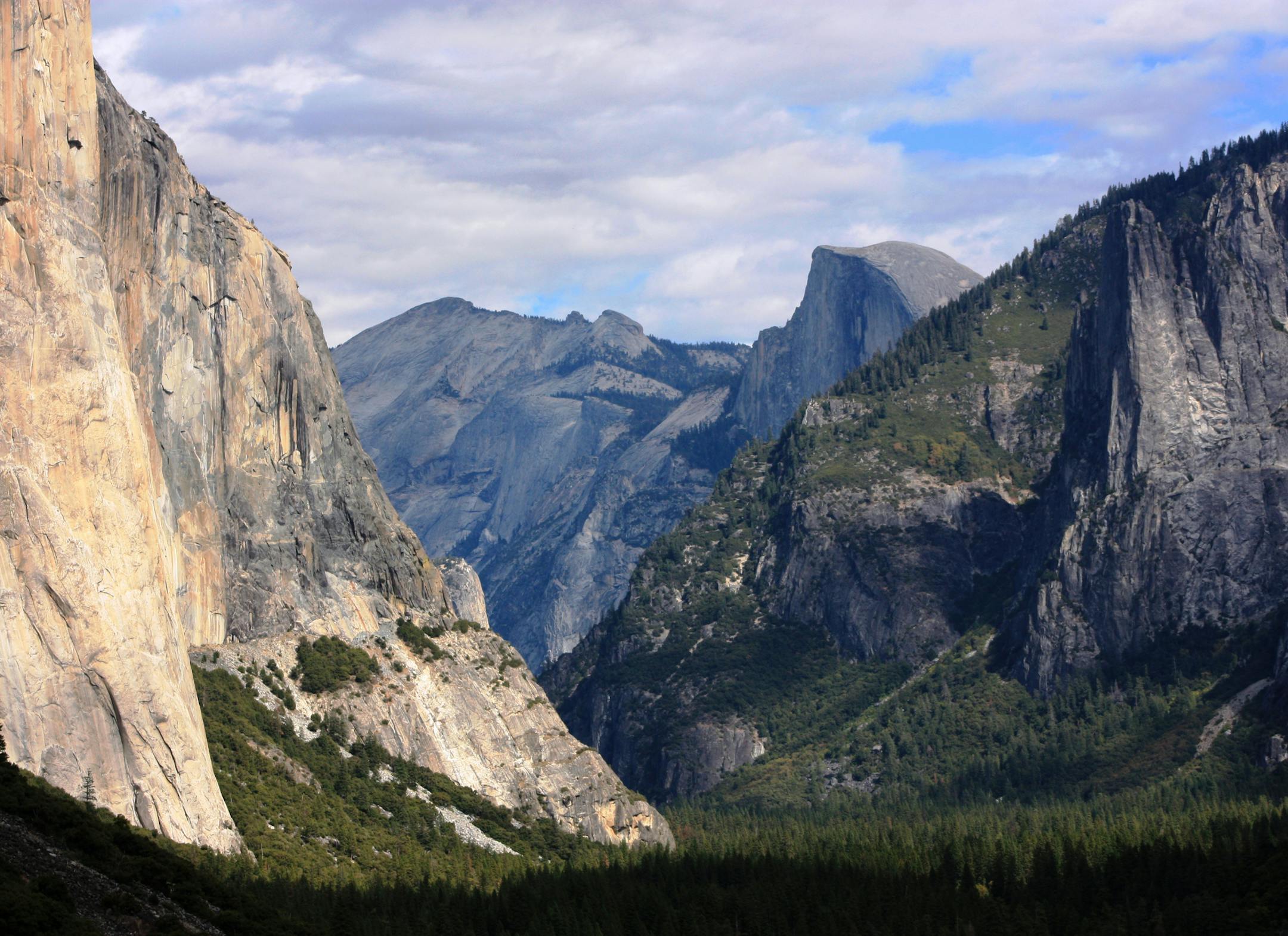 FILE - This Oct. 2, 2013, file photo, shows a view seen on the way to Glacier Point trail in the Yosemite National Park, Calif. Sexual harassment, bullying and other misconduct is rampant among employees at national parks across the country, including at iconic sites such as Yosemite, Yellowstone and the Grand Canyon, a congressional committee was told Sept. 22, 2016. At Yosemite, at least 18 employees have come forward with allegations of harassment or other misconduct so severe that a recent r