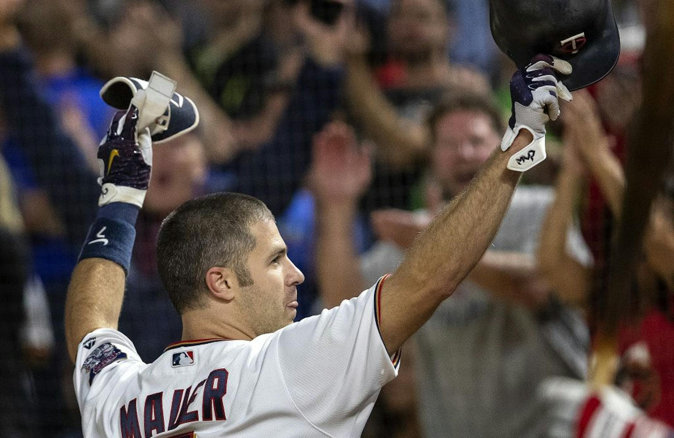 Minnesota Twins Joe Mauer came out for a curtain call after hitting a grand slam home run in the fifth inning.