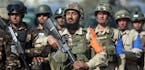 Afghan security forces take part in an exercise in Kabul Garrison compound, in Kabul, Afghanistan, Wednesday, Oct. 7, 2015. Afghan security forces (Ar