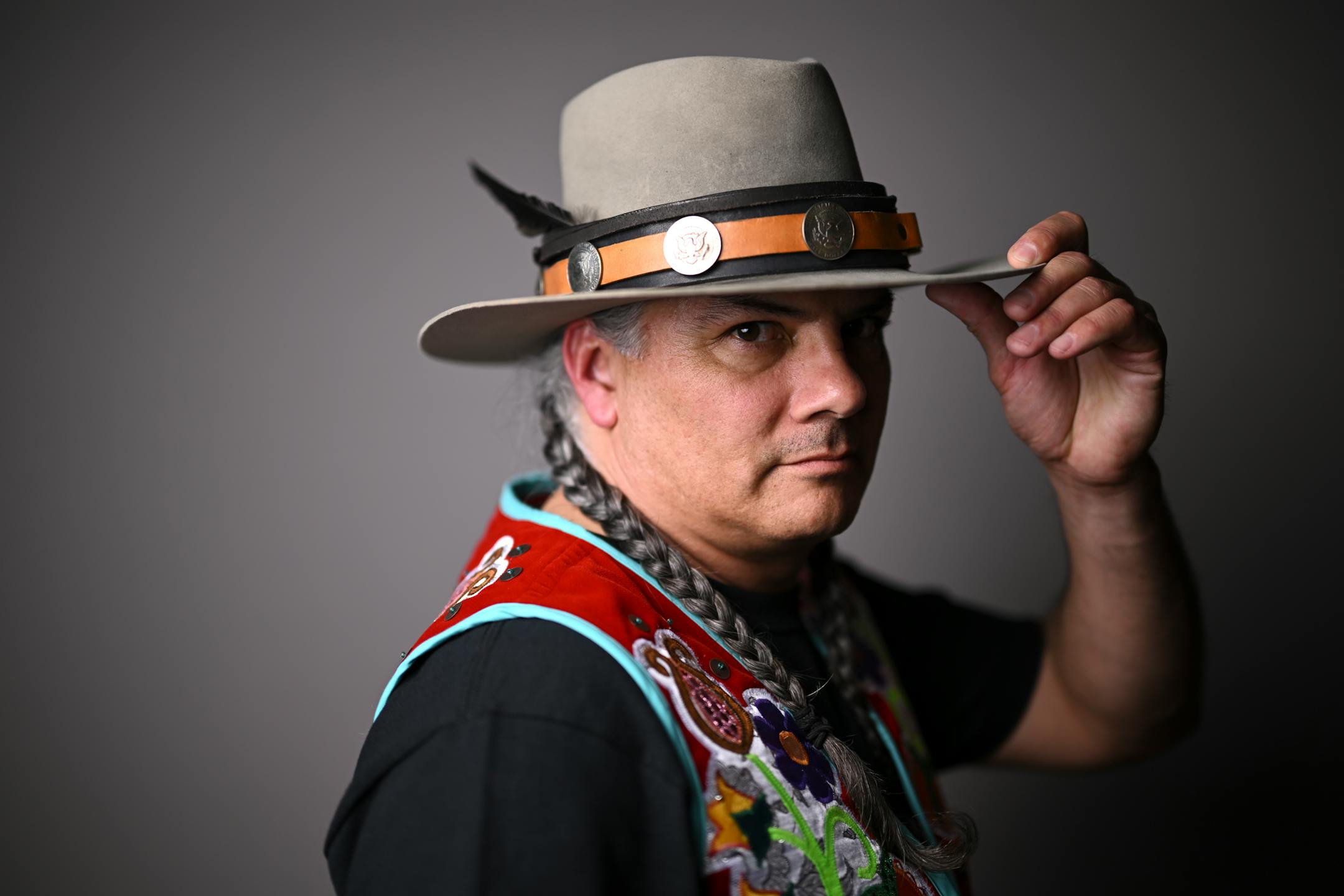 Wiley LaRocque, with the Turtle Mountain Chippewa, stands for a portrait during "Northern Lights: A Native Nations Fashion Night." LaRocque is wearing designs by artist Lavender Hunt.