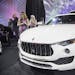 People check out a 2018 Maserati Levante S Granlusso during the Gallery held at Cobo Center in downtown Detroit on January 13, 2018. (Junfu Han/Detroi